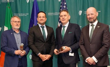 Image of Leo Varadkar and Philip Nolan with the two medal recipients
